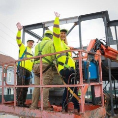 President & CEO Mike Jones and EVP/COO Kim Rock commemorate the final beam installation